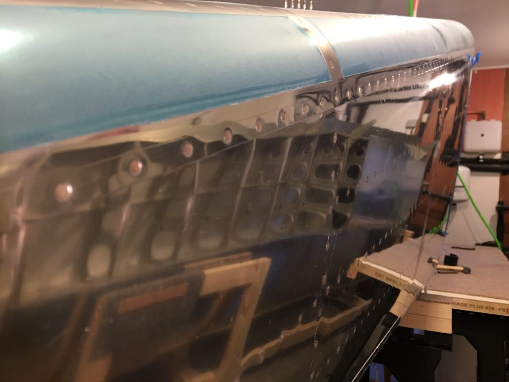Riveting side skins to lower skins